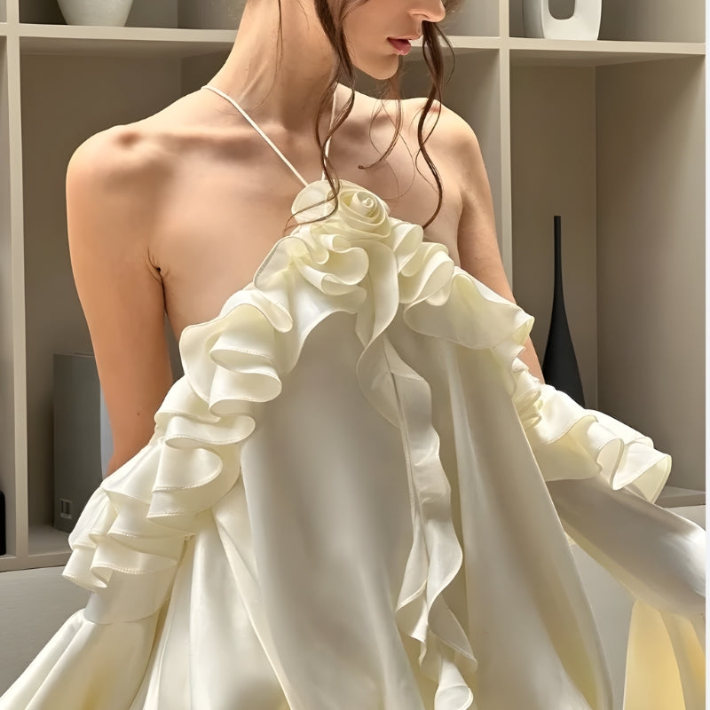 Rose ruffled mini dress by FJØRNA featuring a feminine design, perfect for party or daytime wear, shown on a model.