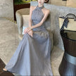 FJØRNA ruched halter women's midi dress featuring a stylish design, perfect for day-to-night wear, shown in the image.
