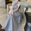 FJØRNA ruched halter women's midi dress featuring a stylish design, perfect for day-to-night wear, shown in the image.