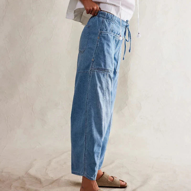 FJØRNA women's cotton pull-on jeans, casual pants with a comfortable fit and classic denim style in a natural pose.