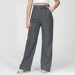 White wide-leg high-waist women's trousers by FJØRNA, stylish and comfortable high-waist pants with a flowing fit.