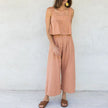 FJØRNA linen cropped culotte trousers for women featuring wide-leg design and lightweight breathable fabric.