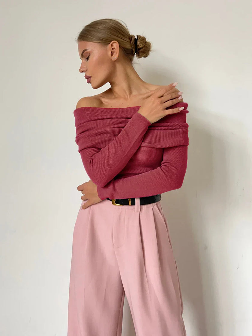 FJØRNA ribbed knit off-shoulder top for women with a mock neck, stylish and fitted, shown on a model.