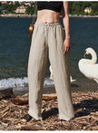 FJØRNA women's knit wide-leg trousers with drawstring waist, showcasing soft fabric, relaxed fit, and stylish casual design.
