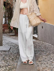 FJØRNA women's knit wide-leg trousers with drawstring waist, showcasing a relaxed fit and soft fabric in natural position.