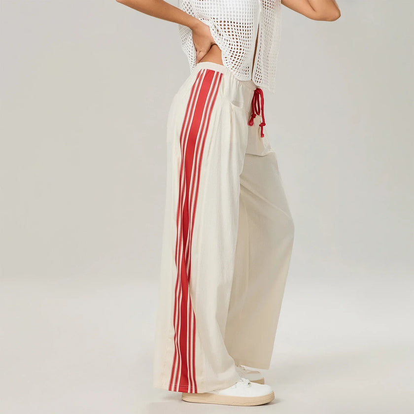 Women’s high waist cotton joggers by FJØRNA with elastic waistband, shown in a casual, relaxed fit style.