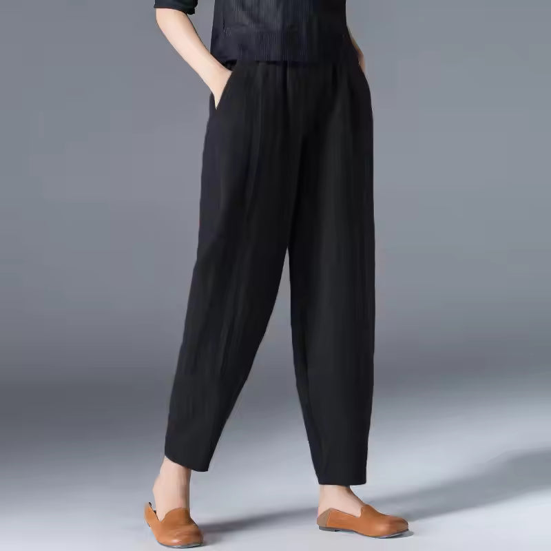 FJØRNA lightweight summer tapered women's trousers with elastic waistband, casual and breathable for warm weather.