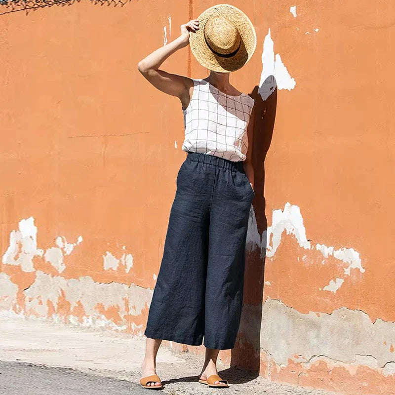FJØRNA women's linen wide leg trousers with drawstring pull-on design, featuring a relaxed fit and lightweight fabric.