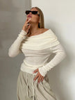 FJØRNA ribbed knit off-shoulder women's top with a mock neck, featuring a fitted design and textured fabric.