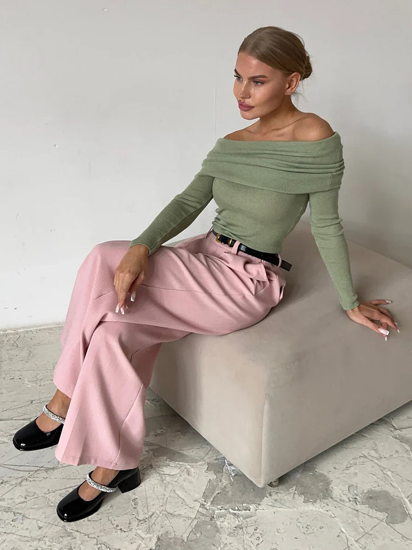 Women’s ribbed knit off-shoulder top by FJØRNA featuring a mock neck, soft fabric, and stylish design.