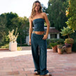 Women's FJØRNA knit wide-leg trousers with a loose pull-on design, soft fabric, and relaxed fit in natural setting