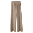 FJØRNA women's joggers, comfortable pants with a relaxed fit and elastic waistband, shown in a casual outdoor setting
