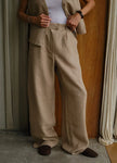 FJØRNA women's linen blend wide-leg high-waist trousers, stylish and comfortable pants for women, shown in natural fabric texture.