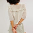 FJØRNA cream cropped cotton blouse for women with lace trim, white top featuring short sleeves and feminine detailing