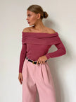 FJØRNA women's ribbed knit off-shoulder top with mock neck, showcasing a fitted, textured fabric design.