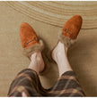 FJØRNA women's plush fur mule slippers with slip-on design and cozy lining for luxurious comfort.