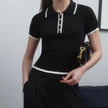 Black cotton polo top for women by FJØRNA, stylish and comfortable women's polo shirt with a classic fit.