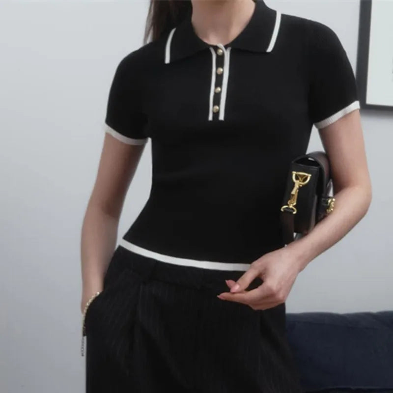 Black cotton polo top for women by FJØRNA, stylish and comfortable women's polo shirt with a classic fit.