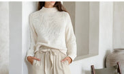 FJØRNA linen wide-leg trousers for women, loose pull-on pants with a relaxed fit and breathable fabric, shown on a model.