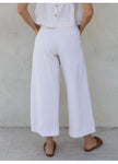 FJØRNA women's linen cropped culotte trousers featuring a wide-leg design, light and breathable fabric for casual style.