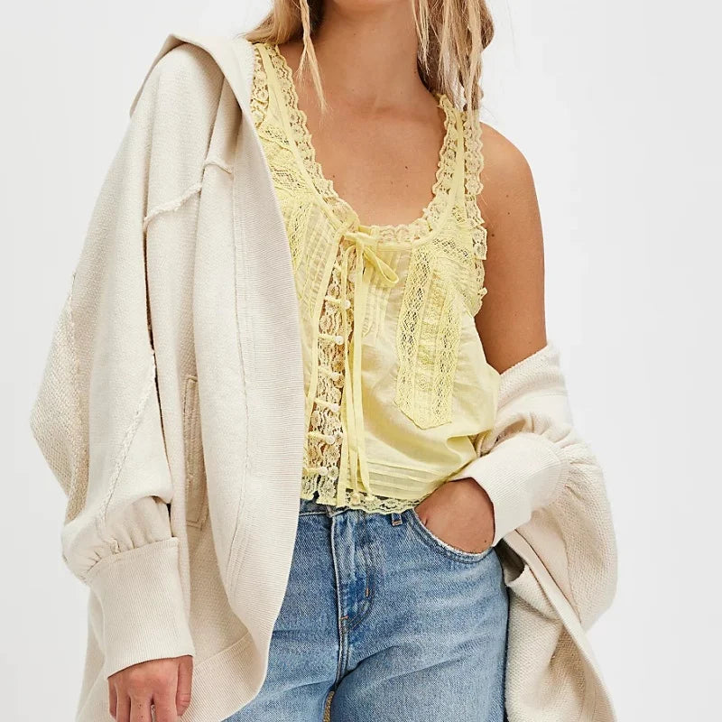 FJØRNA lace cami top for women with front tie, featuring delicate lace fabric and feminine design.