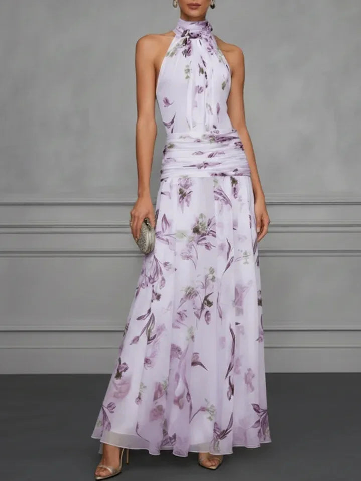 FJØRNA Jasmine floral halter wedding guest dress with elegant design and vibrant floral pattern, perfect for special occasions.