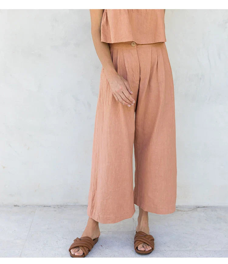 Women’s linen cropped culotte trousers by FJØRNA, wide-leg pants with a relaxed fit and natural linen texture.