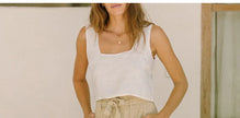 FJØRNA linen wide-leg pants for women, loose pull-on trousers with relaxed fit and natural fabric, displayed on a neutral background.