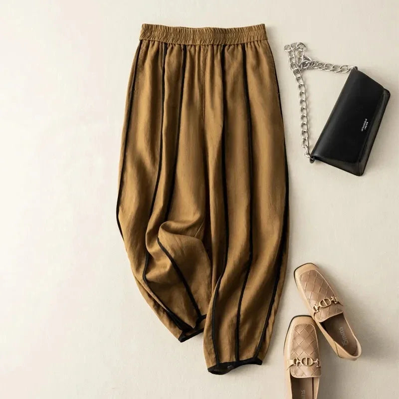 FJØRNA women's linen wide-leg trousers with elastic waistband, relaxed fit, and breathable fabric for comfortable style.