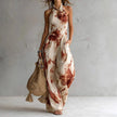 FJØRNA Madison Flowy Halter Maxi Dress in white, sleeveless design with a flowing silhouette and halter neckline.