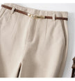Women's wool wide-leg trousers by FJØRNA with high waist and tailored fit, styled for a sophisticated look.