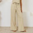 FJØRNA linen wide-leg trousers for women, loose pull-on pants with relaxed fit, light and breathable fabric, front and side view.