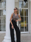 FJØRNA women's linen blend wide-leg high-waist trousers, shown in a natural drape with a relaxed fit and subtle texture.