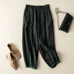 FJØRNA women's linen wide-leg trousers with elastic waist, featuring a relaxed fit and natural fabric for stylish comfort.
