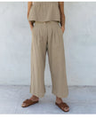 Women’s linen cropped culotte trousers by FJØRNA, wide-leg linen pants with a relaxed fit and stylish design.