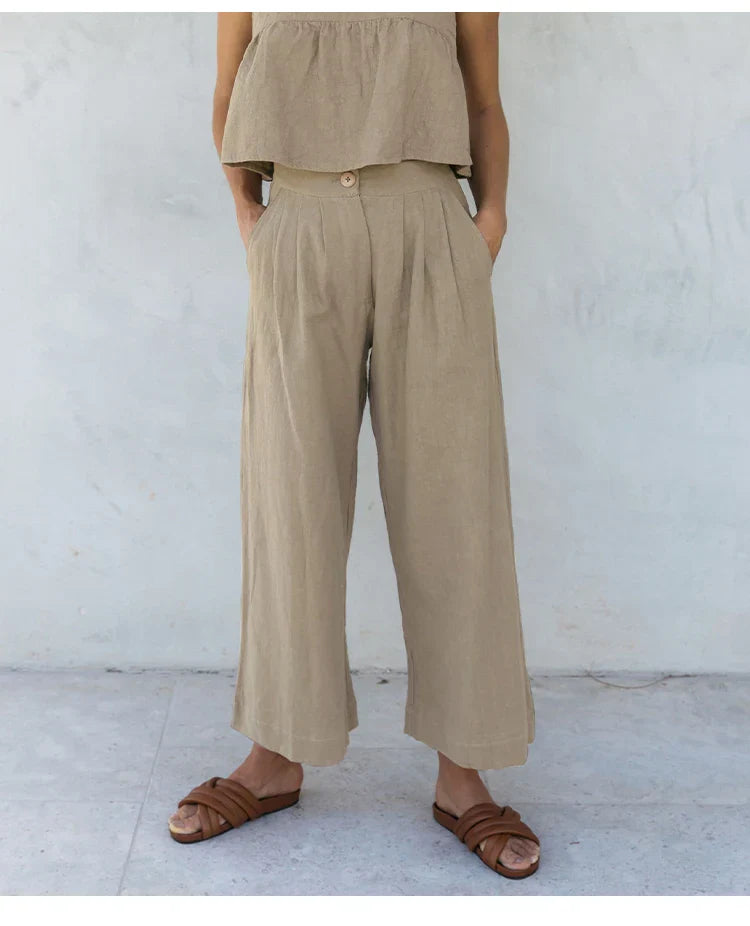 Women’s linen cropped culotte trousers by FJØRNA, wide-leg linen pants with a relaxed fit and stylish design.