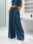 Blue denim wide-leg drawstring pants for women by FJØRNA, relaxed fit jeans with a comfortable waistband.