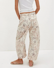 FJØRNA women's wide-leg denim jeans showing high-waisted fit and relaxed silhouette with classic blue denim fabric.