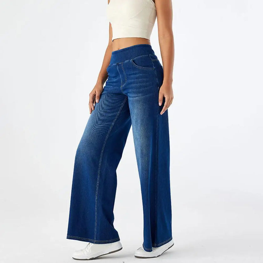 FJØRNA women's lace jeans with wide leg and high waist, showcasing stylish denim pants with intricate lace details.