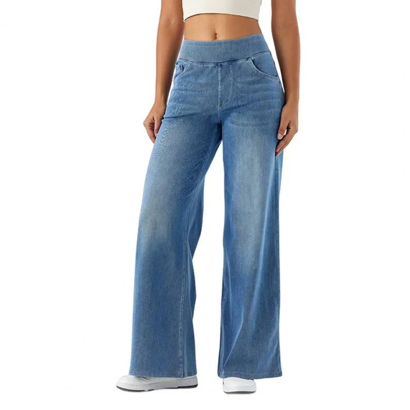 FJØRNA women's lace jeans with wide-leg style and high waist, featuring intricate lace details and a relaxed fit.