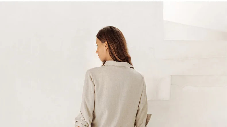 FJØRNA linen wide-leg trousers for women, loose pull-on pants with relaxed fit and breathable fabric, shown in natural light.