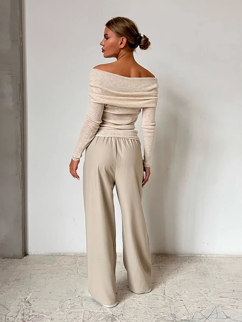 FJØRNA women's ribbed knit off-shoulder top with mock neck, stylish and fitted for casual or dressy occasions.
