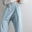 FJØRNA women's wide leg denim jeans, stylish pants with a relaxed fit, displayed on a hanger against a neutral background.