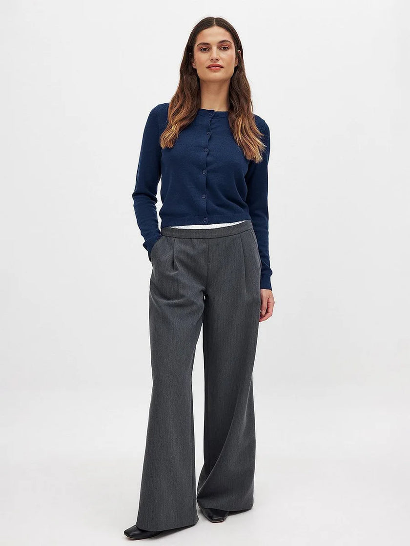 FJØRNA women's longline knit cardigan with button-front design, featuring a cozy, stylish top perfect for layered looks.