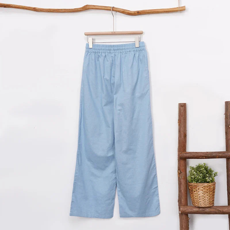 Women’s cotton linen wide-leg trousers by FJØRNA featuring a drawstring pull-on design and relaxed fit.