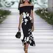 Elegant floral off-shoulder midi dress for women by FJØRNA, featuring a flowing design and feminine style.