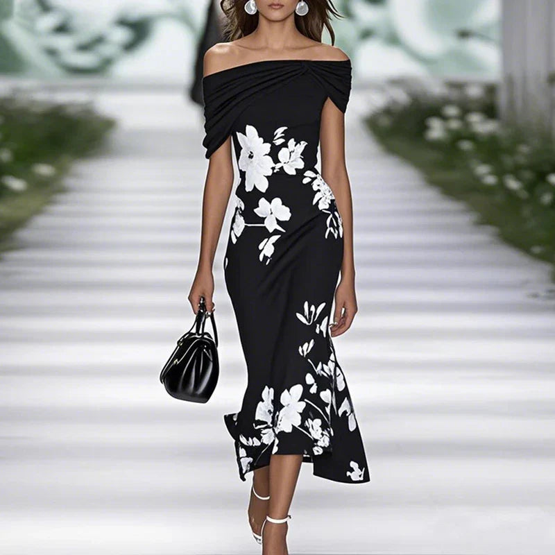 Elegant floral off-shoulder midi dress for women by FJØRNA, featuring a flowing design and feminine style.