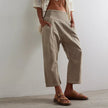 FJØRNA women's wide-leg denim trousers with relaxed fit and classic five-pocket design, shown on a model.