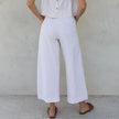 FJØRNA women's linen cropped culotte trousers with wide-leg fit, lightweight and breathable for a stylish summer look.