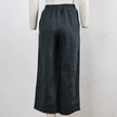 FJØRNA linen wide-leg women's trousers with drawstring pull-on design, featuring a relaxed fit and lightweight fabric.